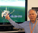 Man pointing to a presentation of Louisiana Immersive Technologies Enterprise virtual environment